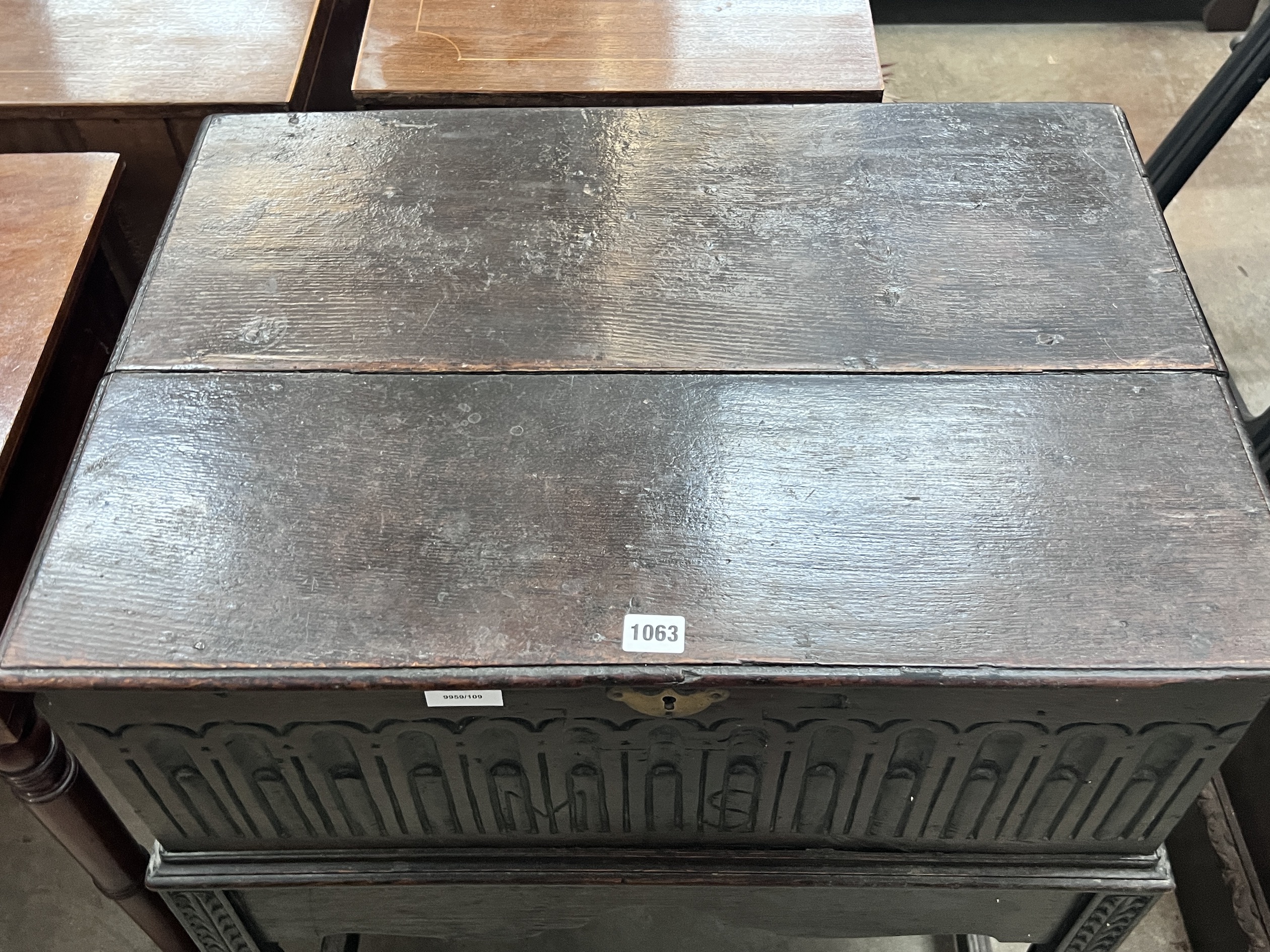 A 17th century style oak bible box on associated stand, width 68cm, depth 49cm, height 80cm
